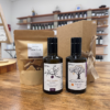 Coffret de deux bouteilles d'huile d'olive et un sachet de canistrelli